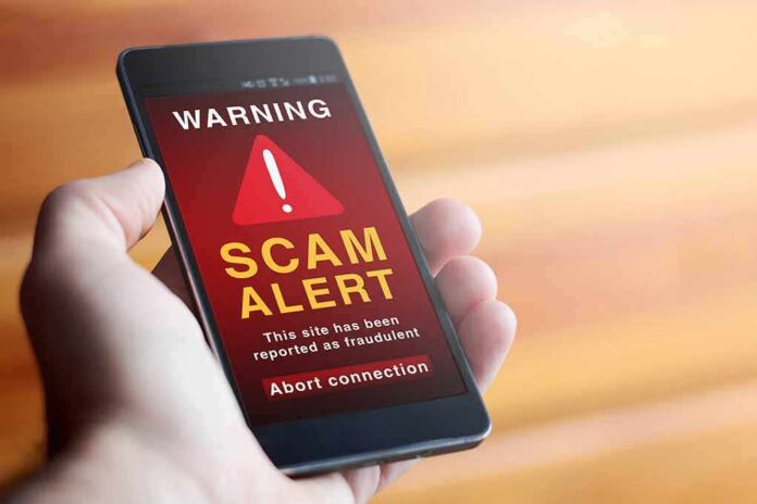 1927116176 featured image Phone showing scam alert warning message.