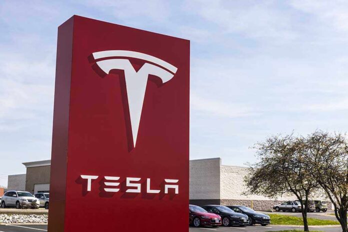 620657588 featured image Tesla sign in front of dealership.