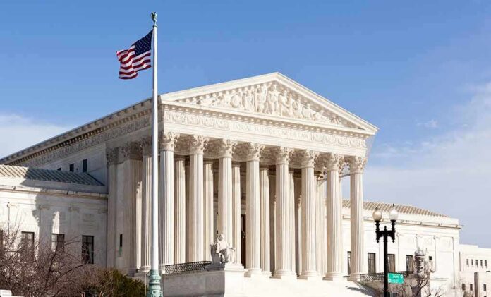 96721225 featured image United States Supreme Court building with American flag