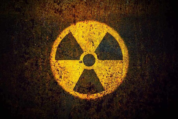 1082372921 featured image Yellow radiation warning symbol on rusty metal surface.