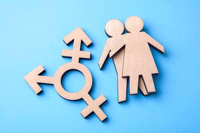 1145016626 featured image Wooden gender symbols on a blue background