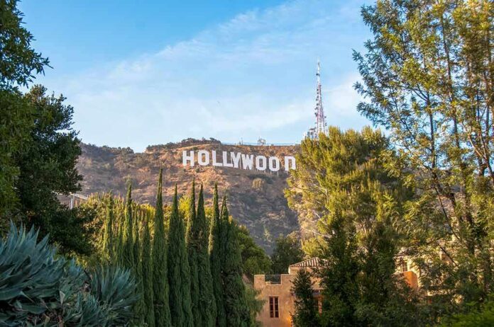 1164563563 featured image Hollywood sign on hill surrounded by trees and buildings.