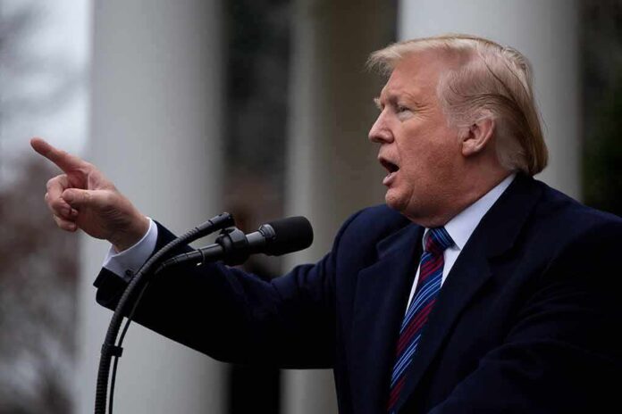 1276349383 featured image Man speaking into microphone, pointing finger.
