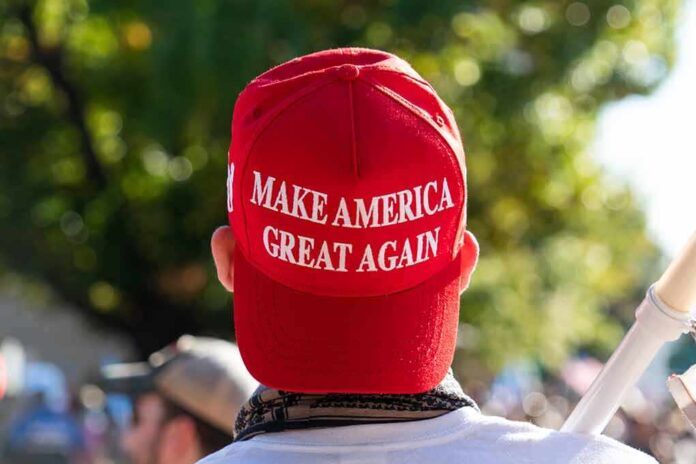 Person wearing a red Make America Great Again hat.