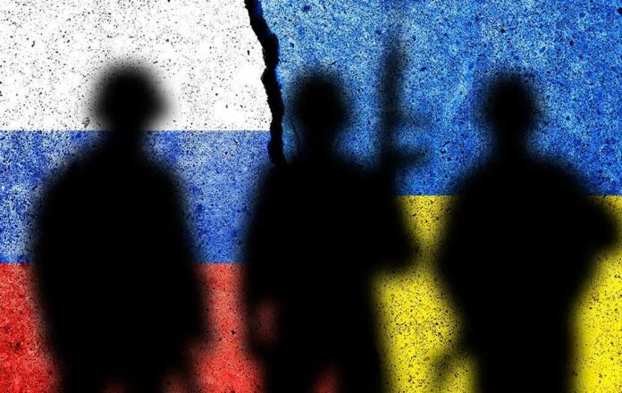 2095910923 featured image Silhouettes with Russian and Ukrainian flags background