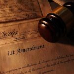 Gavel on 1st Amendment and We the People documents