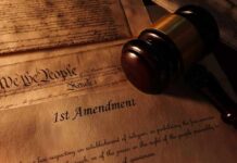 Gavel on 1st Amendment and We the People documents