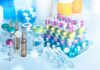 Vials and blister packs of pills on table.