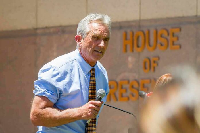 1401970814 featured image Man speaking with microphone outside building with lettering