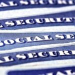 Blue Social Security cards piled together