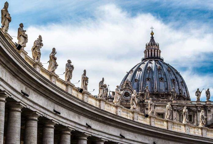 368201633 featured image St Peter Basilica dome with statues and clouds