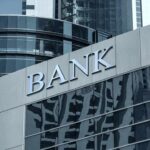 Unlock Financial Growth: How High-Yield Savings Outshine Traditional Accounts Modern bank building with reflective glass exterior