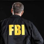 FBI agent with back facing the camera