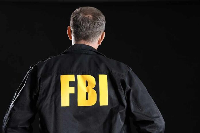2473870221 featured image FBI agent with back facing the camera