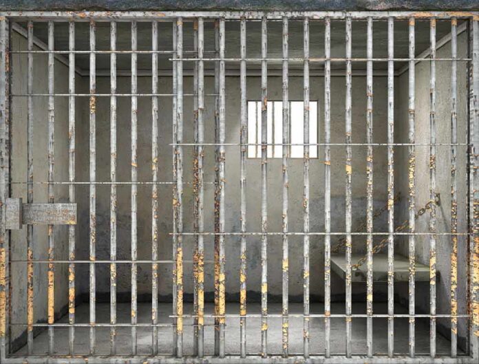 508424233 featured image Empty rusty prison cell with a small window