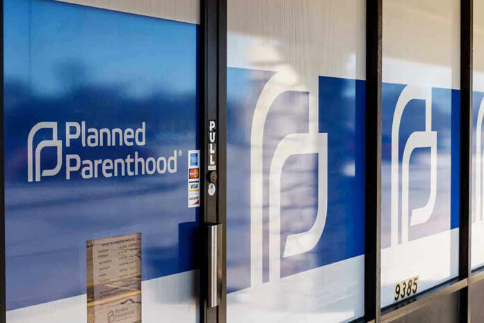 Planned Parenthood office entrance with logo and signs.