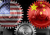 Interlocking gears with USA and China flags