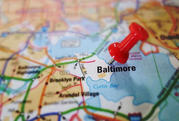 shutterstock_185722670.jpg A red pushpin marking the location of Baltimore on a map