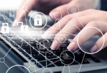 Hands typing with cybersecurity icons overlay