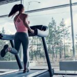 Famous Fitness Guru Flips From Liberal to a Key MAHA Figure A woman running on a treadmill in a gym with large windows