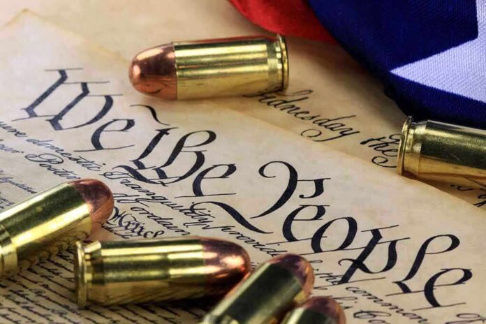 shutterstock_170423123.jpg Close up of bullets surrounding a historical document with the phrase We the People
