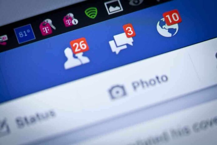 shutterstock_176941343.jpg Close up of a smartphone screen displaying Facebook notifications