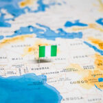 Flag pin marking Nigeria on Africa map