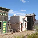 Wild West themed bank and jail buildings in a desert setting