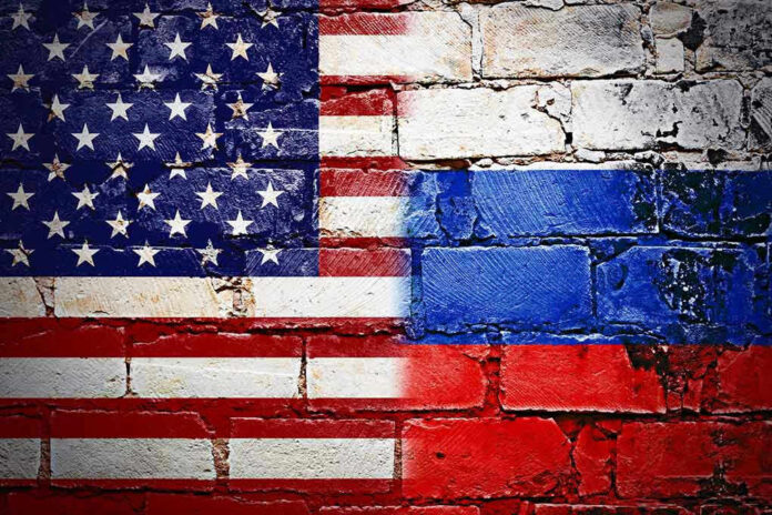 549429280 United States and Russian flags painted on brick wall.