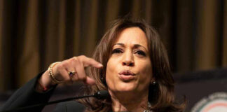 Person speaking passionately at a podium.