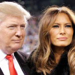 Two people posing closely at an event.