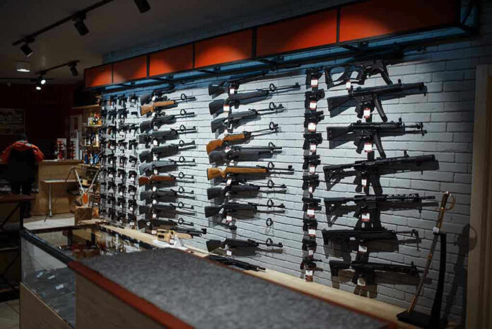Wall-mounted guns displayed in a store. Wall-mounted guns displayed in a store.