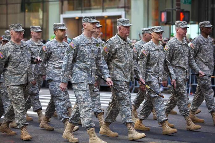 Group of soldiers marching in a military parade on a city street