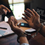 Shark Tank Star ARRESTED — Horrifying Charges Person handcuffed in discussion with another person