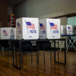 Voting booths set up in a room.