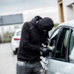 Mayor Praises Defunding Police: Then Her Car Is Stolen AT City Hall Person in black breaking into a car.