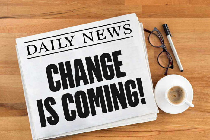 Newspaper headline Change Is Coming on table