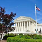 Conservative Court Future Hinges on Retirement Supreme Court building with American flag and surrounding greenery