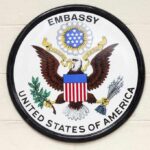 Trump’s SHOCKING Embassy Evacuation Order Seal of the United States Embassy featuring an eagle and the American flag