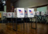 Voting booths set up in a room.