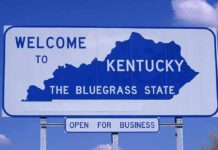 Welcome sign for Kentucky, the Bluegrass State, with a blue background