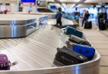 Luggage on a conveyor belt at an airport baggage claim area