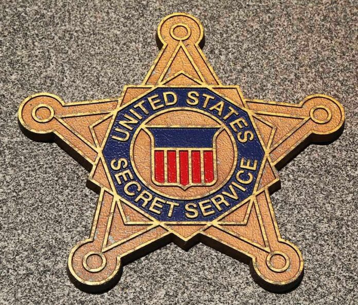 shutterstock_134990735.jpg Golden badge of the United States Secret Service displayed on a surface