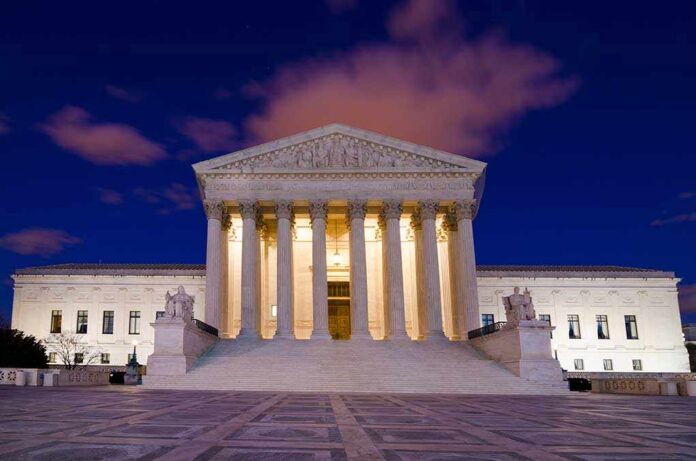 shutterstock_147164960.jpg The Supreme Court building illuminated at night with a clear sky