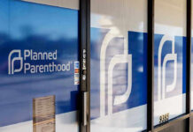 Planned Parenthood office entrance with logo and signs.