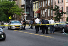 Bizarre HomeWreck: Husband’s Excavator Rampage Police gathered at an urban crime scene.