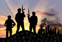 SHOCK: Nigeria-U.S. Kill World’s ‘Most Active’ Terrorist Three armed silhouettes near a smoky city skyline.