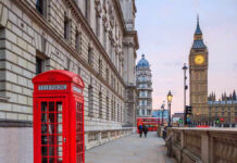 Royal Scandal Deepens: Prince Andrew’s Dark Ties Red telephone booth near Big Ben in London.