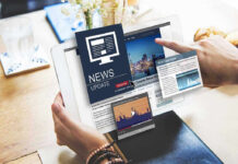 Person reading digital news on a tablet device