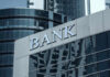 Bank building with glass facade and modern architecture.
